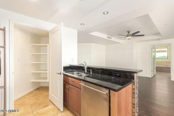a kitchen with a sink and cabinets