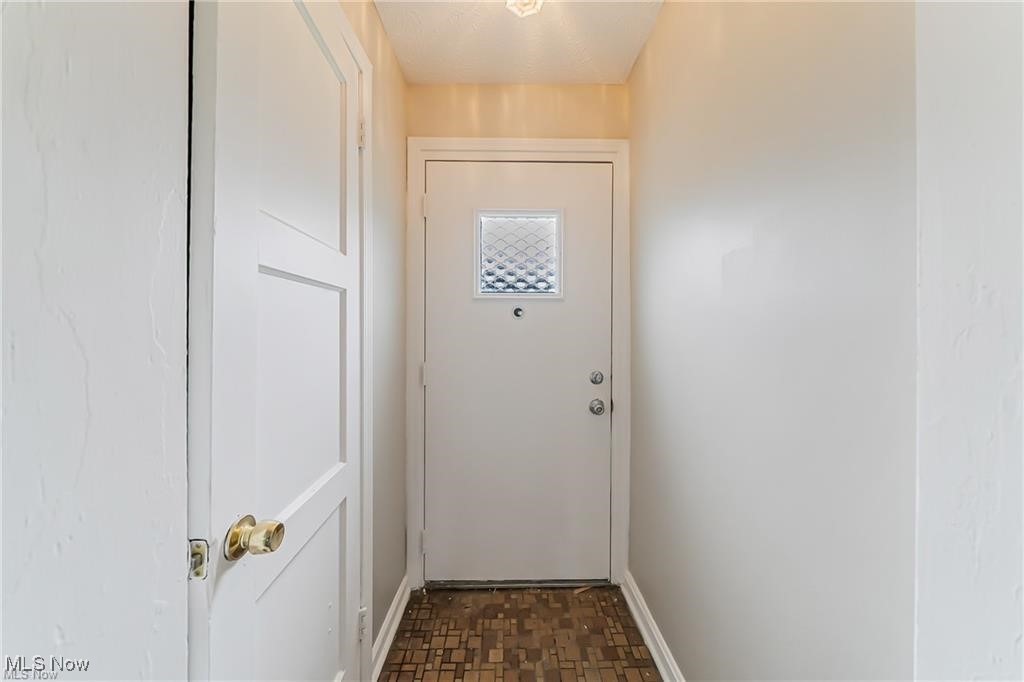 3837 Mayfield Road Cleveland, OH 44121 - Photo 4 of 29 Doorway to outside with baseboards