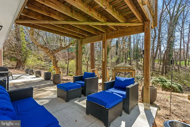 a view of living room with couch and wooden floor