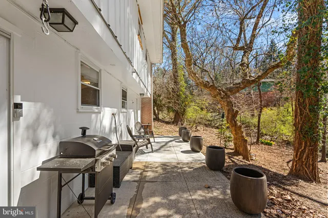 a view of a patio with iron fence