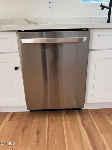a view of a livingroom with wooden floor
