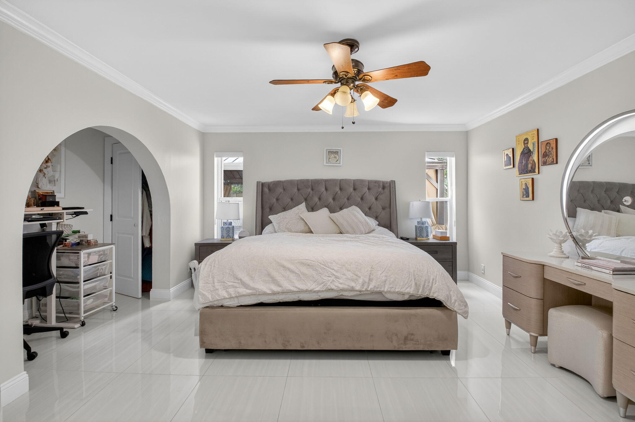2402 Northwest 30th Street Boca Raton, FL 33431 - Photo 18 of 45 a bedroom with a bed and a chandelier