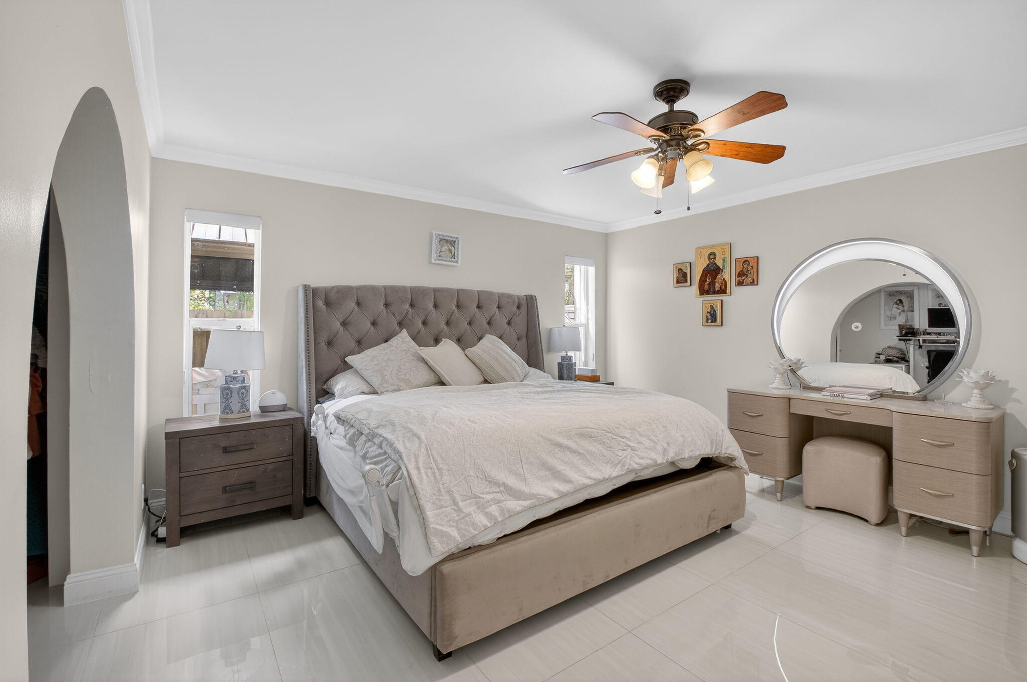 2402 Northwest 30th Street Boca Raton, FL 33431 - Photo 19 of 45 a bedroom with a bed and a chandelier