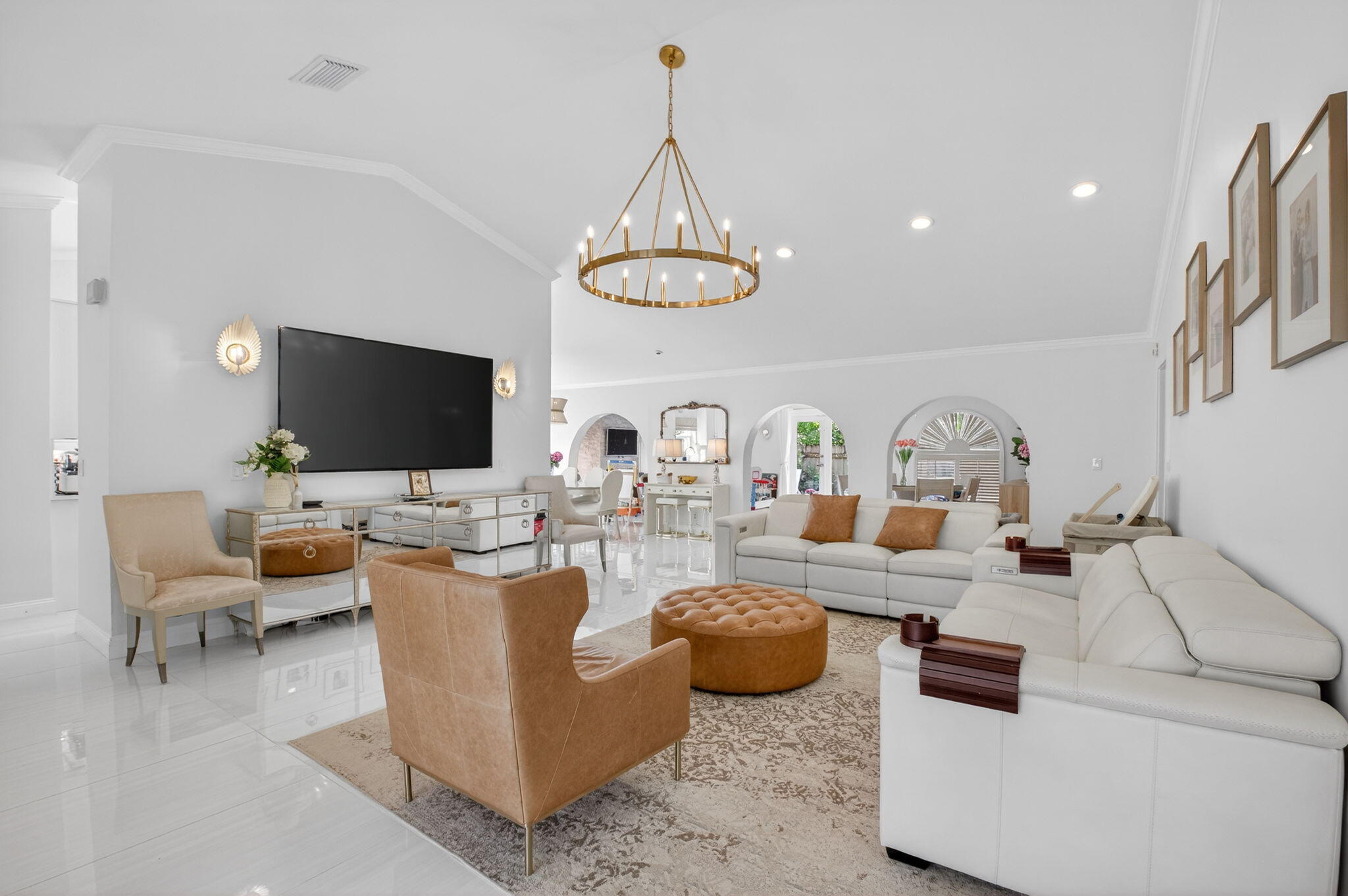 2402 Northwest 30th Street Boca Raton, FL 33431 - Photo 2 of 45 a living room with furniture a flat screen tv and kitchen view