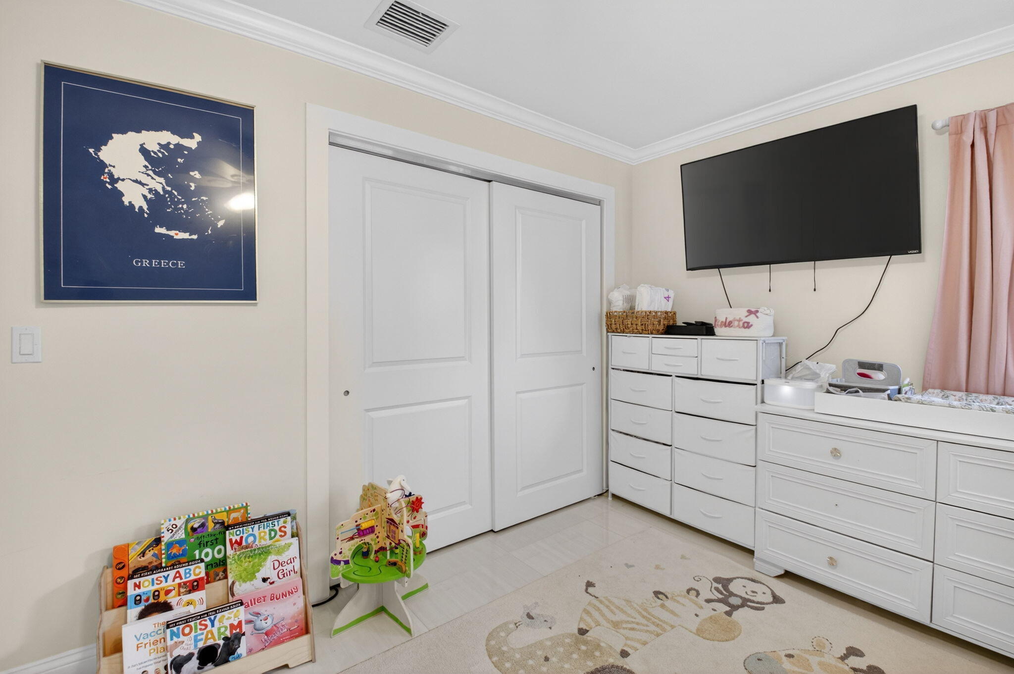 2402 Northwest 30th Street Boca Raton, FL 33431 - Photo 25 of 45 a living room with furniture and a flat screen tv