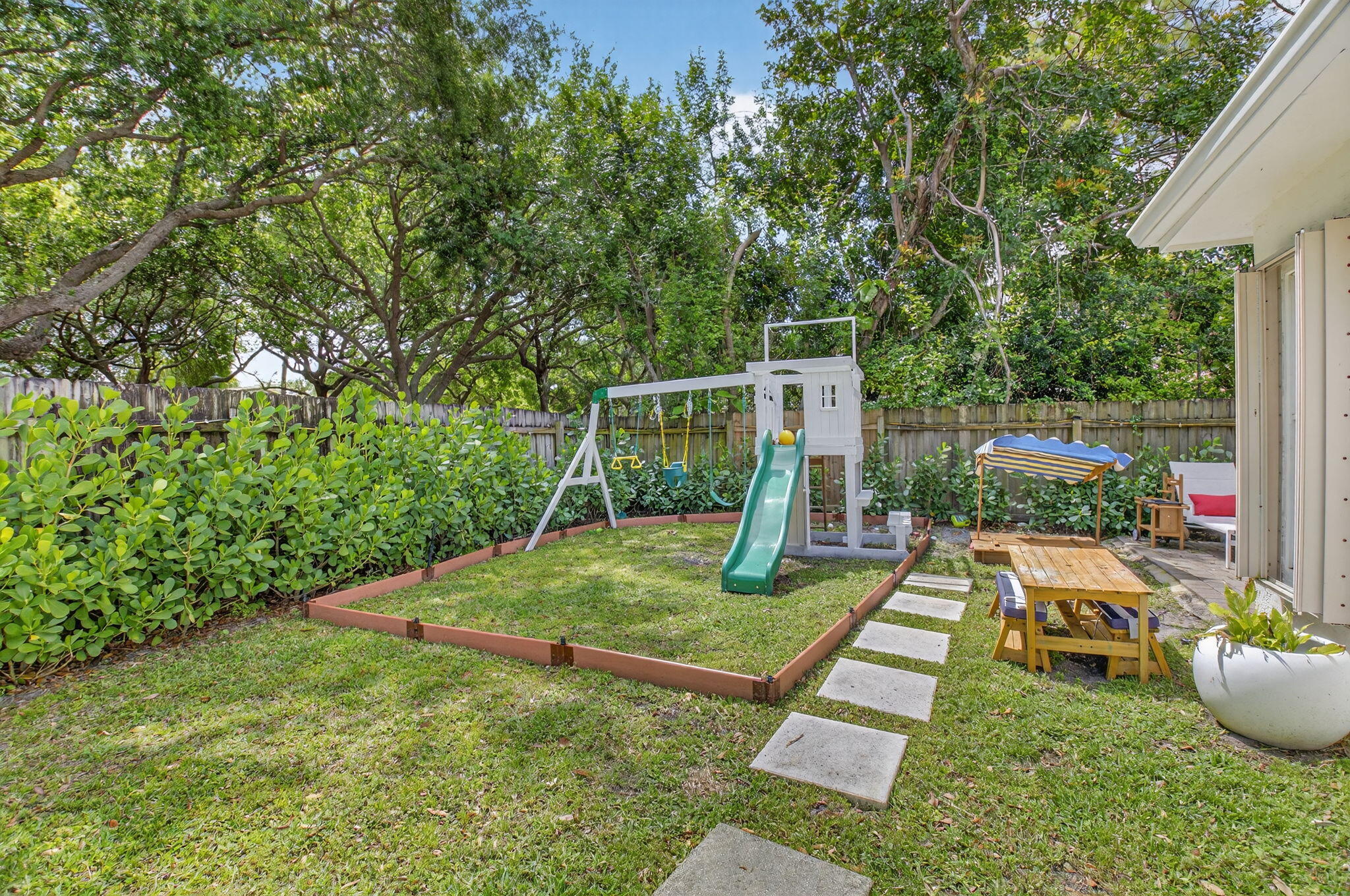 2402 Northwest 30th Street Boca Raton, FL 33431 - Photo 33 of 45 a view of backyard with seating and green space