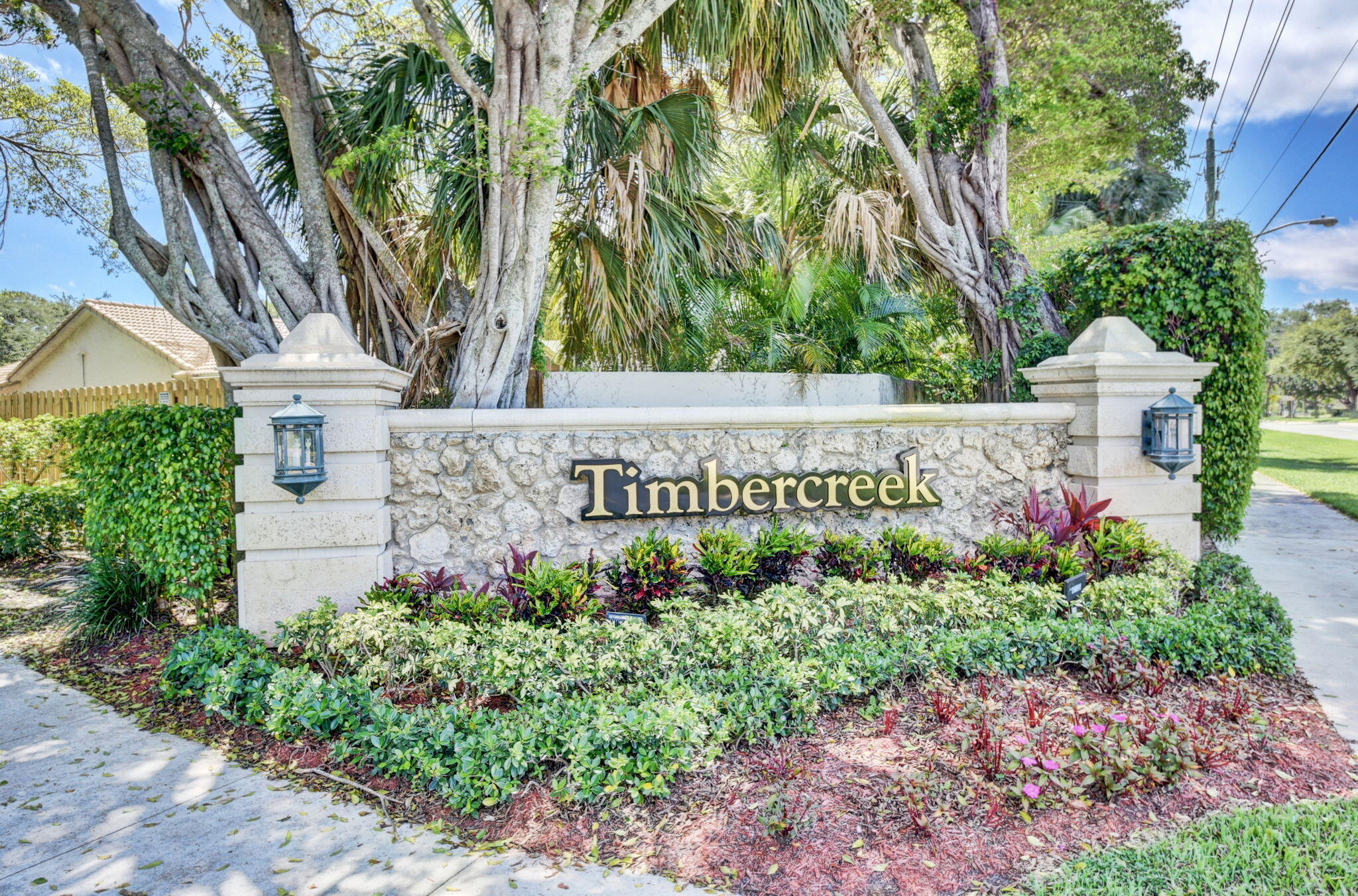 2402 Northwest 30th Street Boca Raton, FL 33431 - Photo 35 of 45 a sign that is in front of flowers
