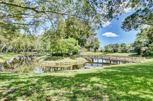 a view of a backyard with sitting area