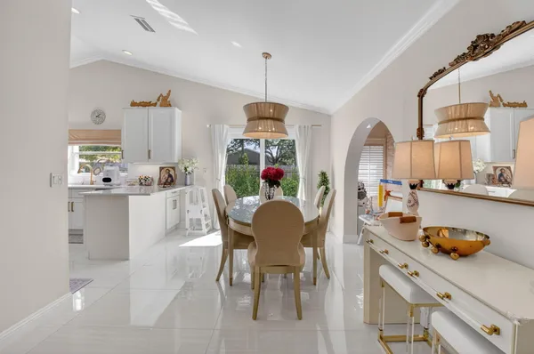 a dining room with furniture and window