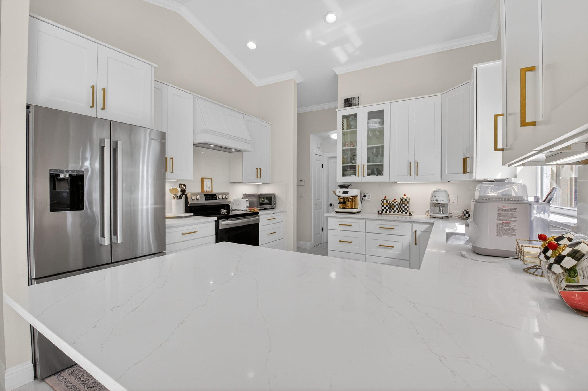 2402 Northwest 30th Street Boca Raton, FL 33431 - Photo 10 of 45 a large white kitchen with cabinets