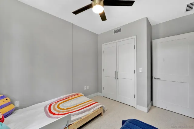 a room with a bed and a chandelier