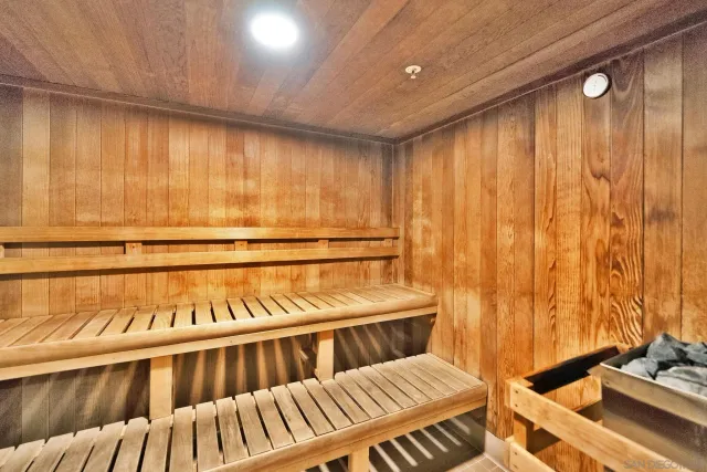 a view of a room with furniture and a window