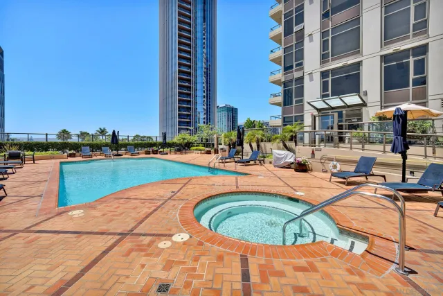 a view of a swimming pool with a lounge chair