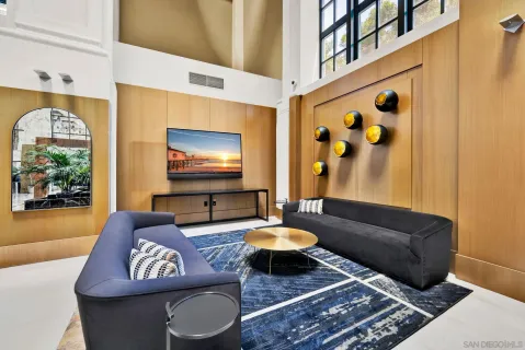 a living room with furniture and a rug