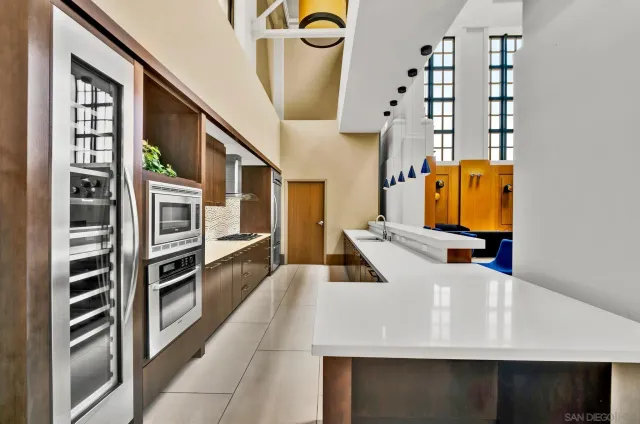 a view of an entryway and kitchen