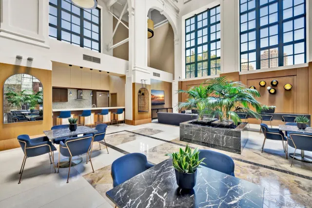 a view of a patio with couches and potted plants