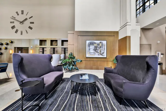 a living room with furniture and a rug