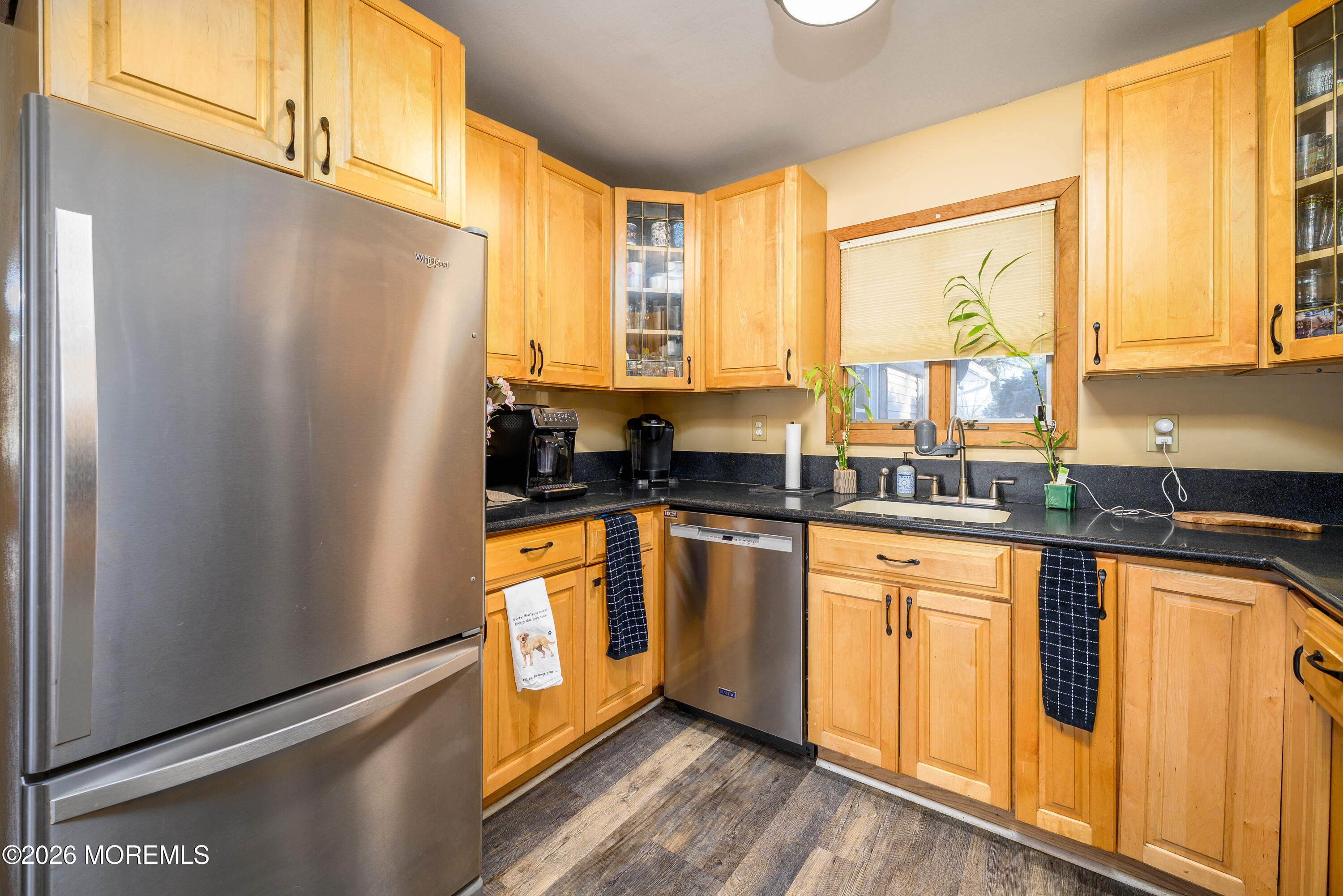 351 Taylors Mills Road Manalapan, NJ 07726 - Photo 4 of 29 a kitchen with stainless steel appliances granite countertop a refrigerator a sink and white cabinets