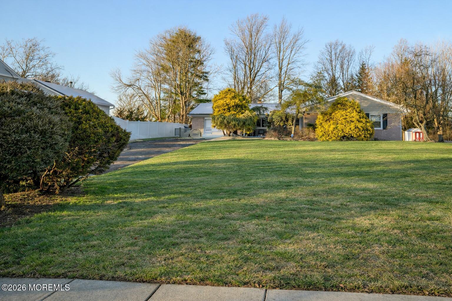 351 Taylors Mills Road Manalapan, NJ 07726 - Photo 5 of 29 a view of a park with large trees