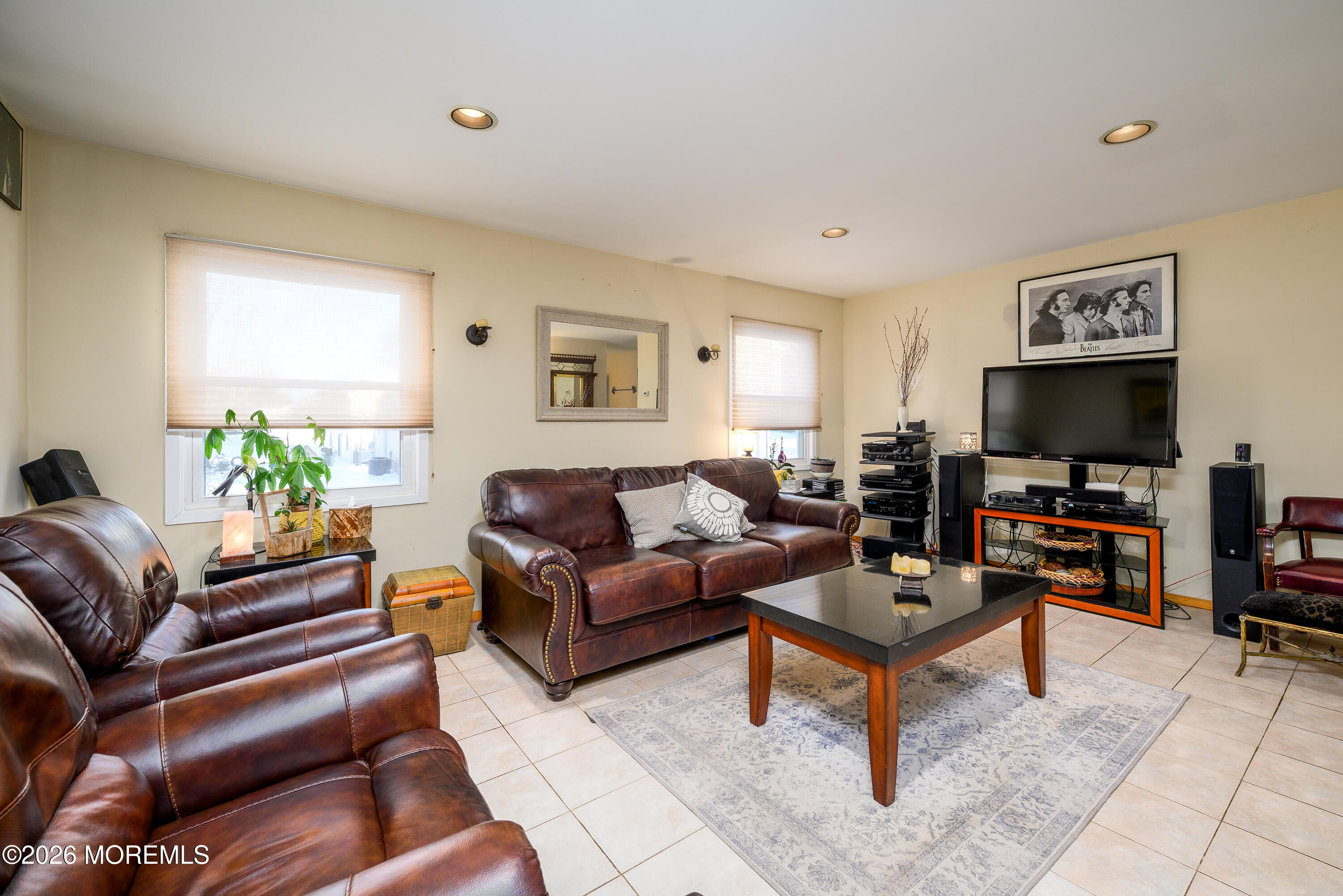 351 Taylors Mills Road Manalapan, NJ 07726 - Photo 10 of 29 a living room with furniture and a flat screen tv