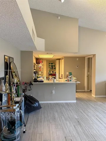 a view of room with wooden floor