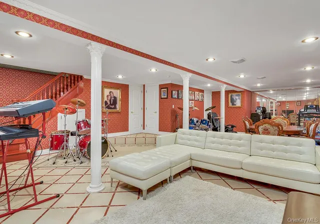 a living room with furniture and a rug