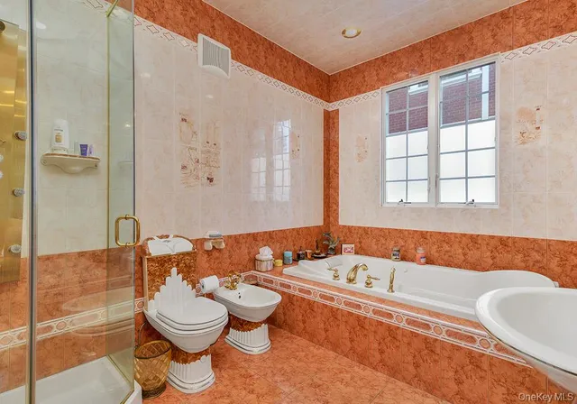 a bathroom with a bathtub sink and toilet