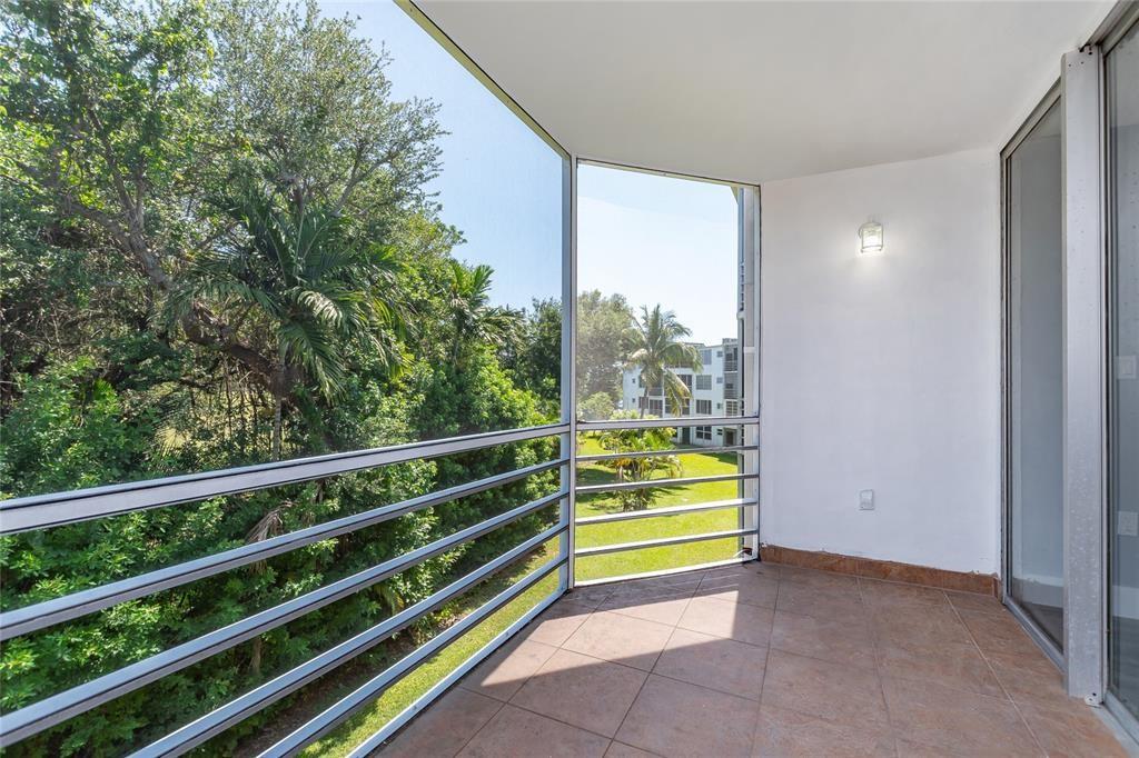 1101 Northeast 191st Street, Unit H301 Miami, FL 33179 - Photo 16 of 18 a view of outdoor space and deck