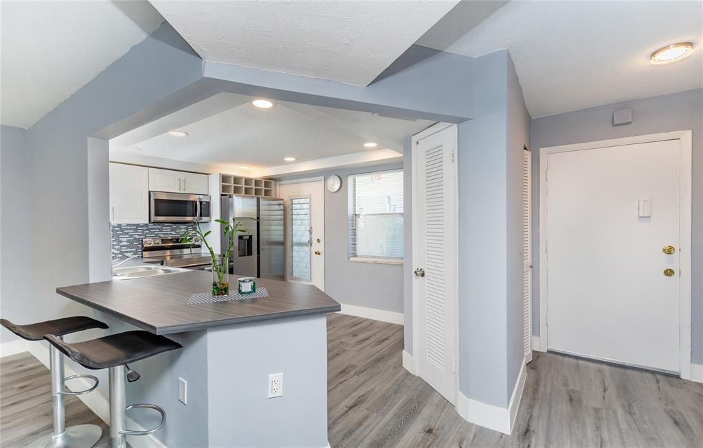 1101 Northeast 191st Street, Unit H301 Miami, FL 33179 - Photo 2 of 18 a view of kitchen and windows