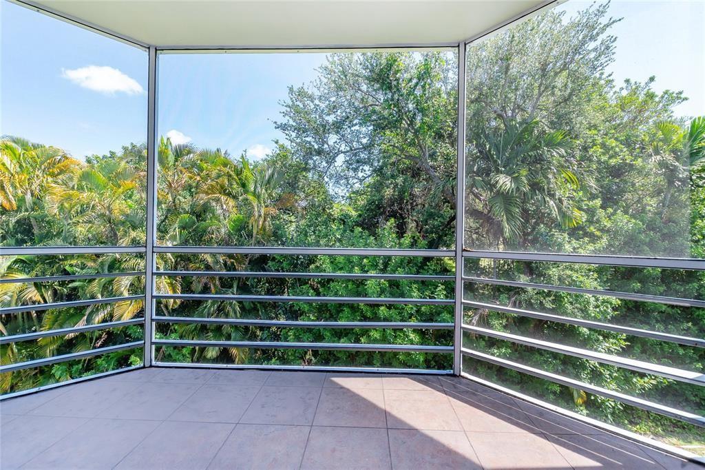 1101 Northeast 191st Street, Unit H301 Miami, FL 33179 - Photo 8 of 18 a view of a room with racks on the wall