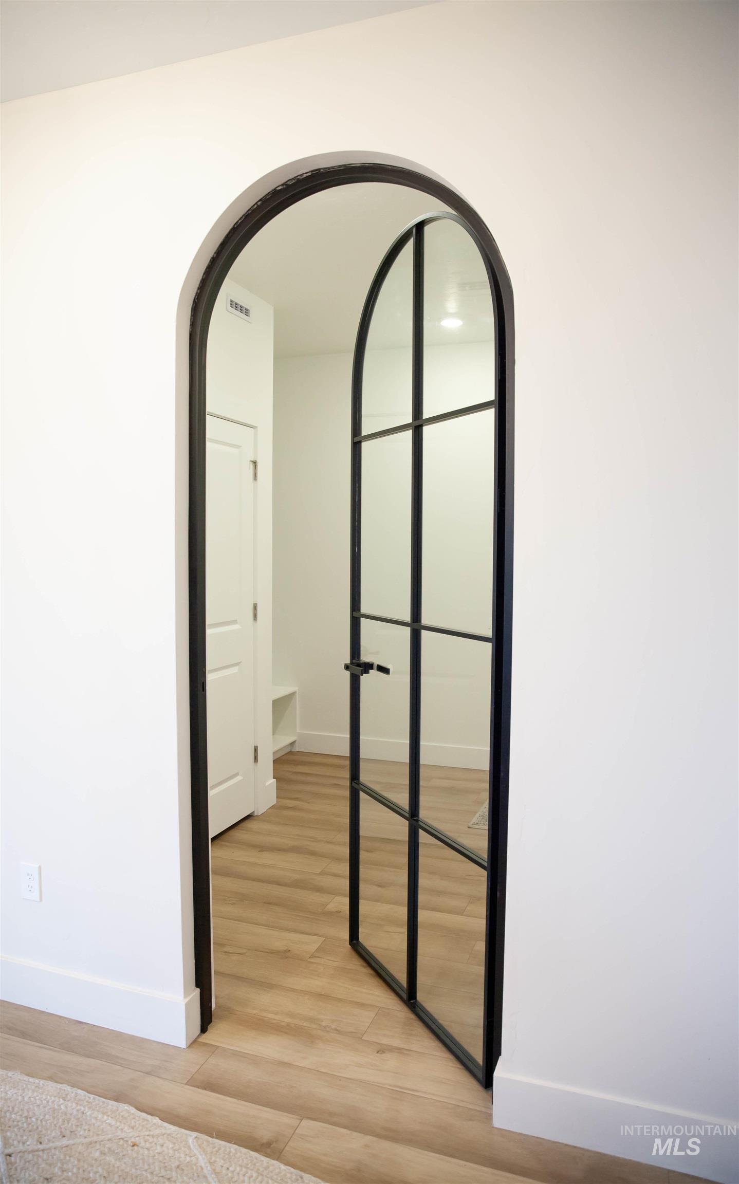 151 Insight Court Middleton, ID 83644 - Photo 12 of 35 Detailed view of arched walkways and wood finished floors