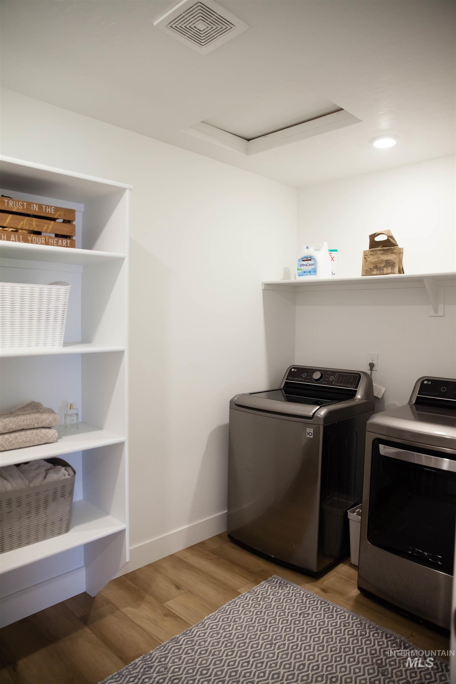 151 Insight Court Middleton, ID 83644 - Photo 23 of 35 Laundry area featuring light wood finished floors and washer and clothes dryer