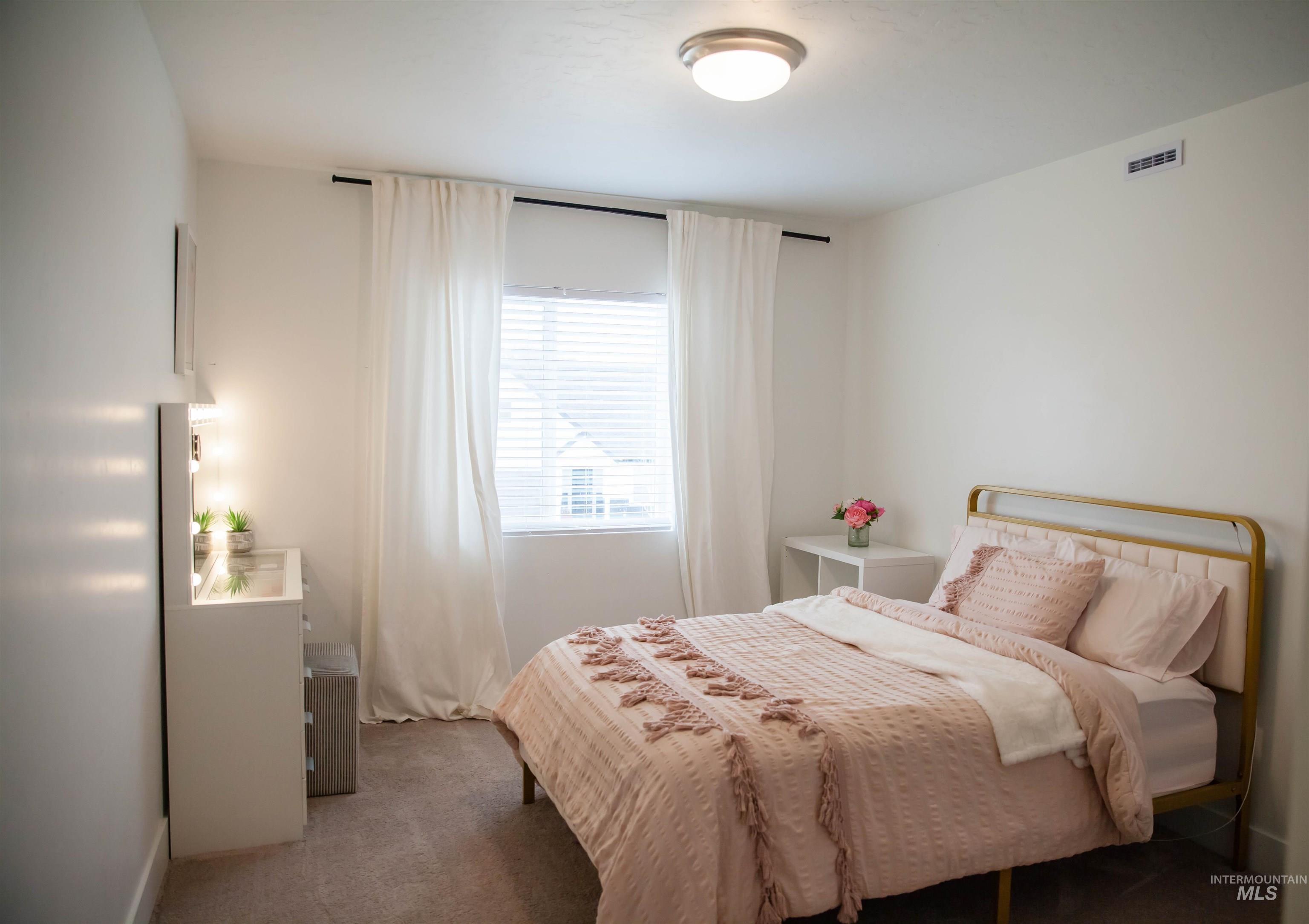 151 Insight Court Middleton, ID 83644 - Photo 24 of 35 Bedroom featuring dark carpet