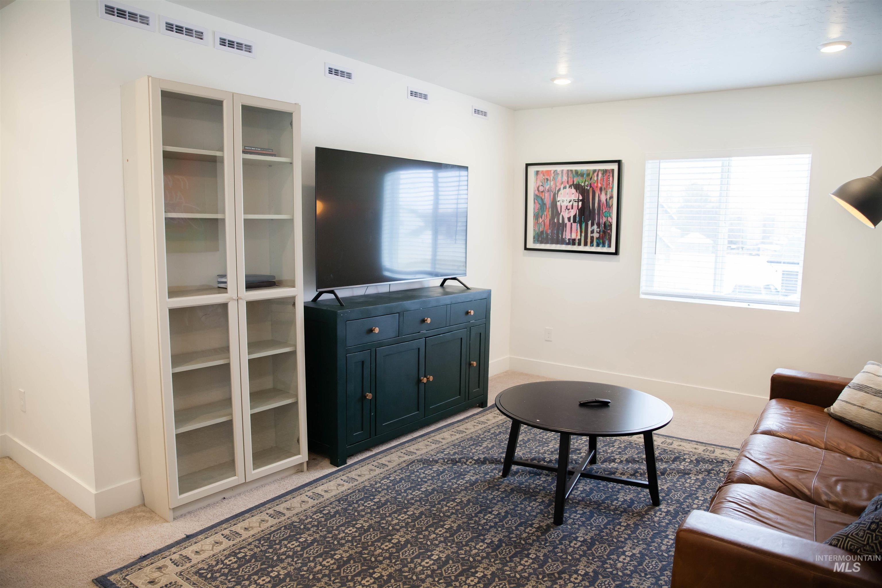 151 Insight Court Middleton, ID 83644 - Photo 28 of 35 Living room with plenty of natural light, light carpet, and recessed lighting