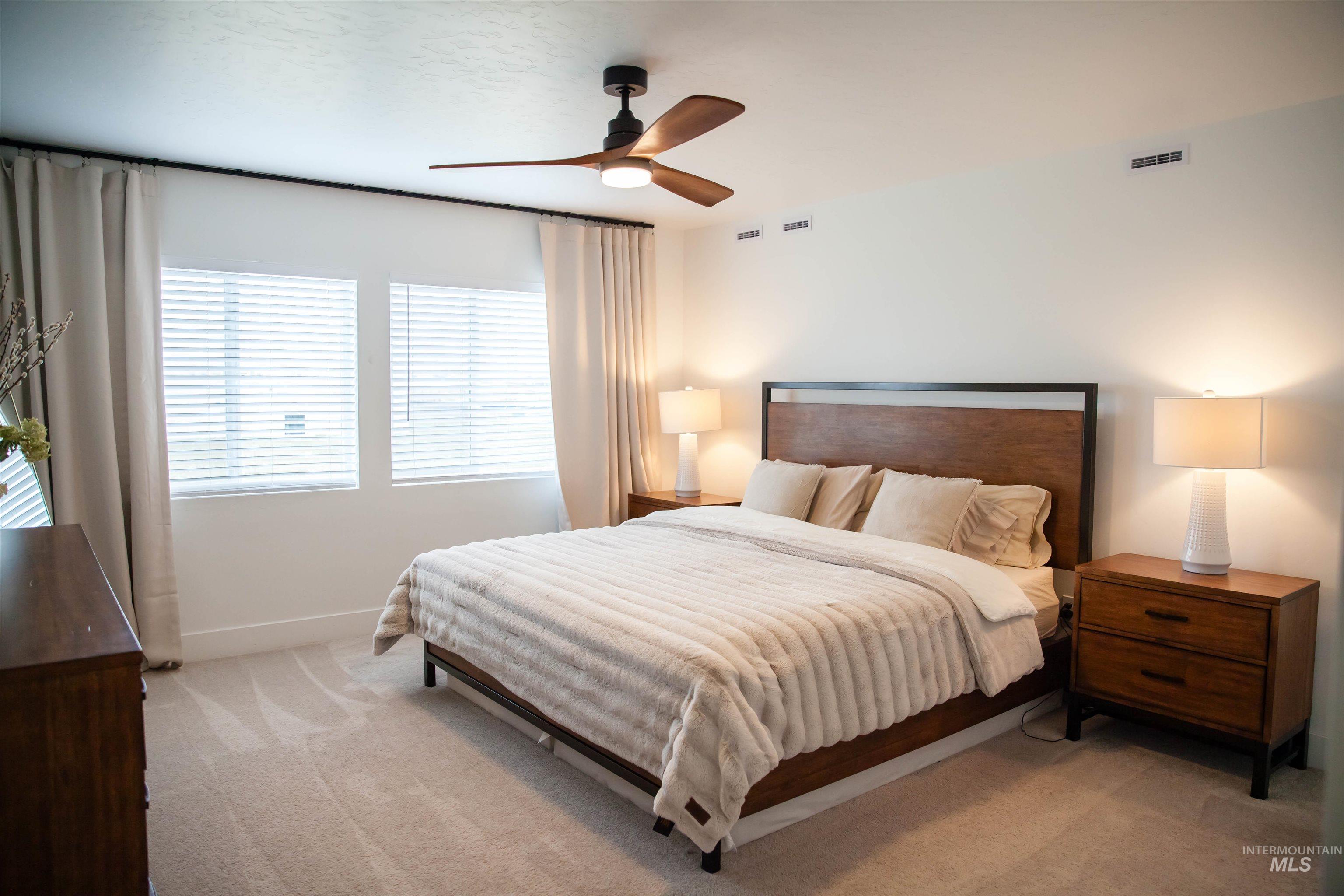 151 Insight Court Middleton, ID 83644 - Photo 8 of 35 Bedroom with light carpet and ceiling fan