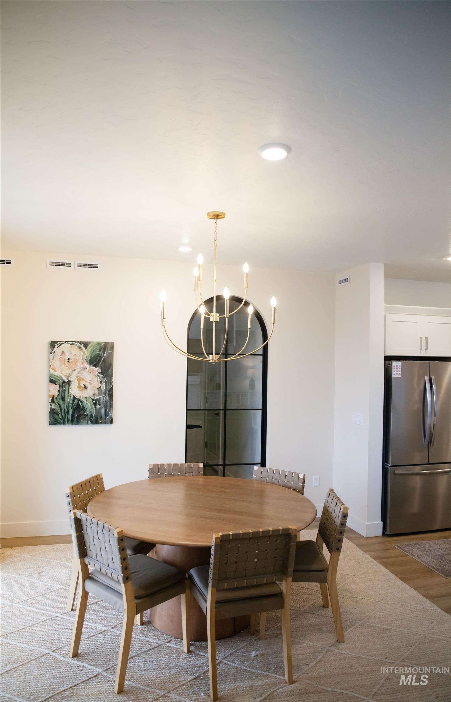151 Insight Court Middleton, ID 83644 - Photo 9 of 35 Dining room featuring light wood-style floors and hanging lights