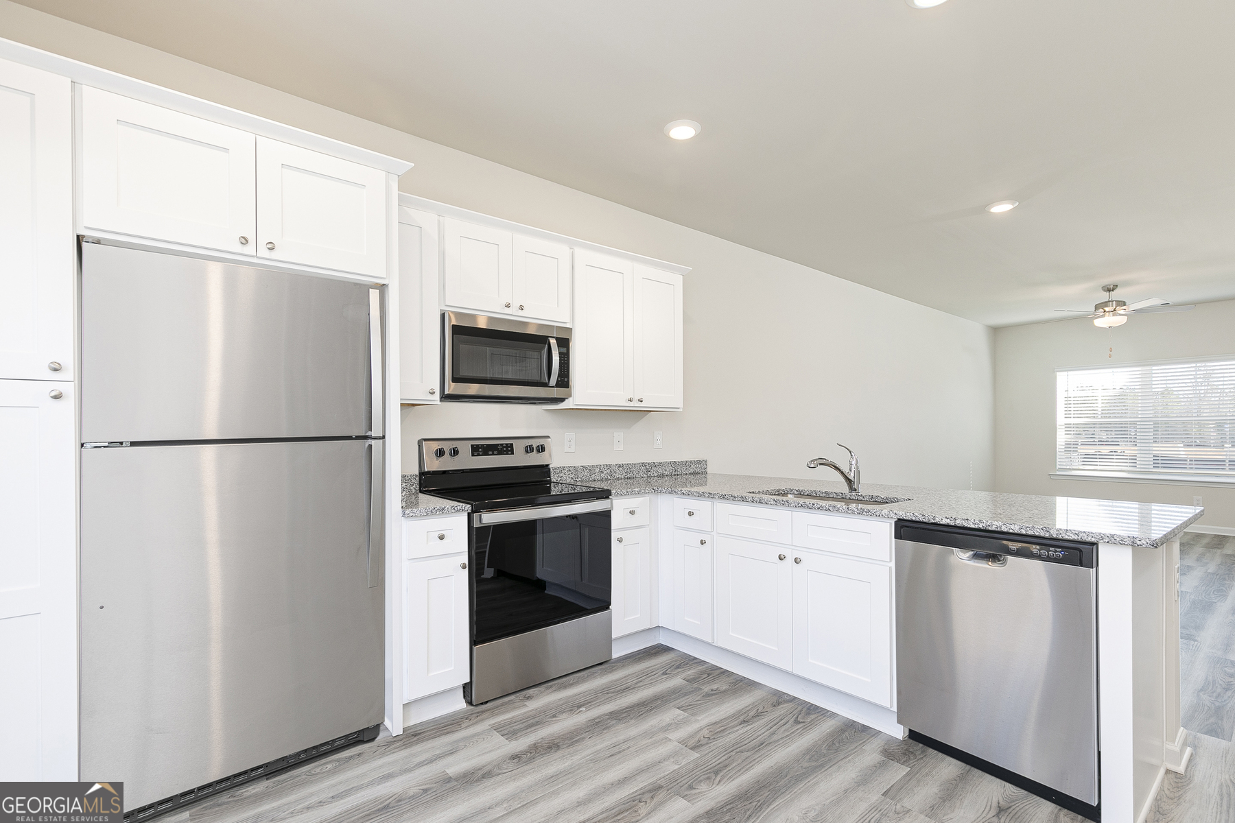 226 Rooker Drive LaGrange, GA 30241 - Photo 5 of 15 a kitchen with stainless steel appliances granite countertop a refrigerator stove a sink and a microwave
