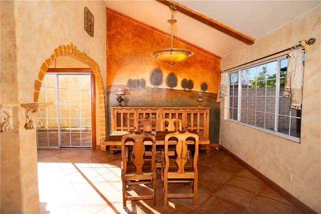 a view of a balcony with furniture and wooden floor