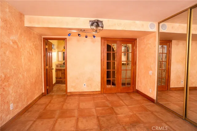 a view of a hallway with wooden walls