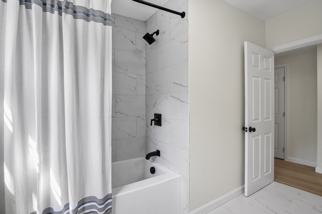 128 Dana Road Oxford, MA 01540 - Photo 15 of 23 a bathroom with a bathtub and shower