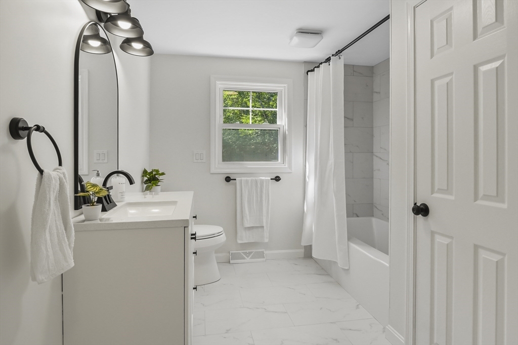 128 Dana Road Oxford, MA 01540 - Photo 16 of 23 a view of a bathroom with a tub and shower