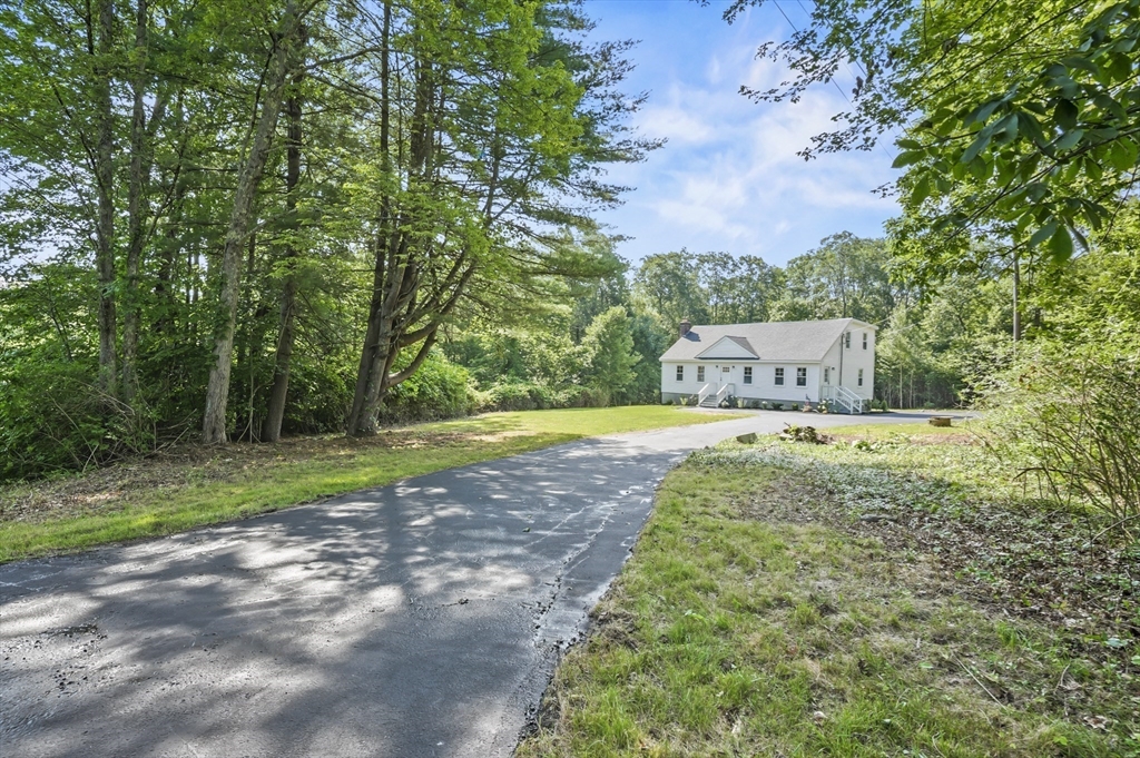 128 Dana Road Oxford, MA 01540 - Photo 3 of 23 a view of a swimming pool with a yard