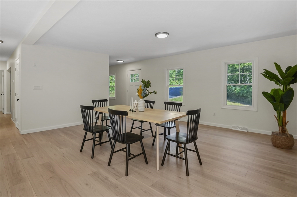 128 Dana Road Oxford, MA 01540 - Photo 6 of 23 a view of a dining room with furniture and a potted plant