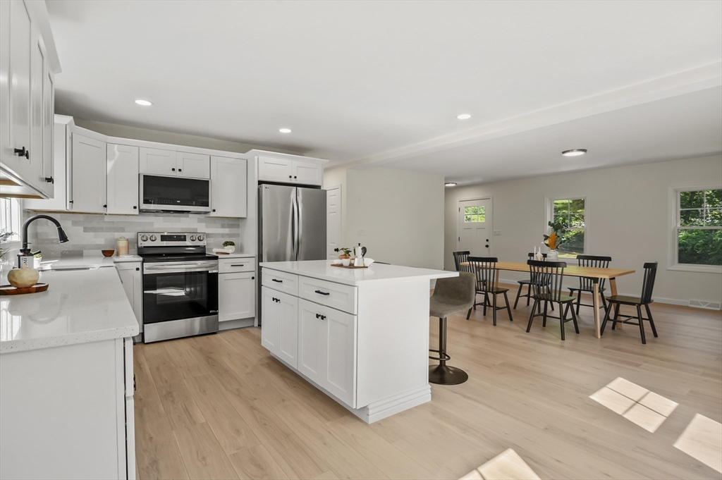 128 Dana Road Oxford, MA 01540 - Photo 8 of 23 a kitchen with cabinets a sink and a stove top oven