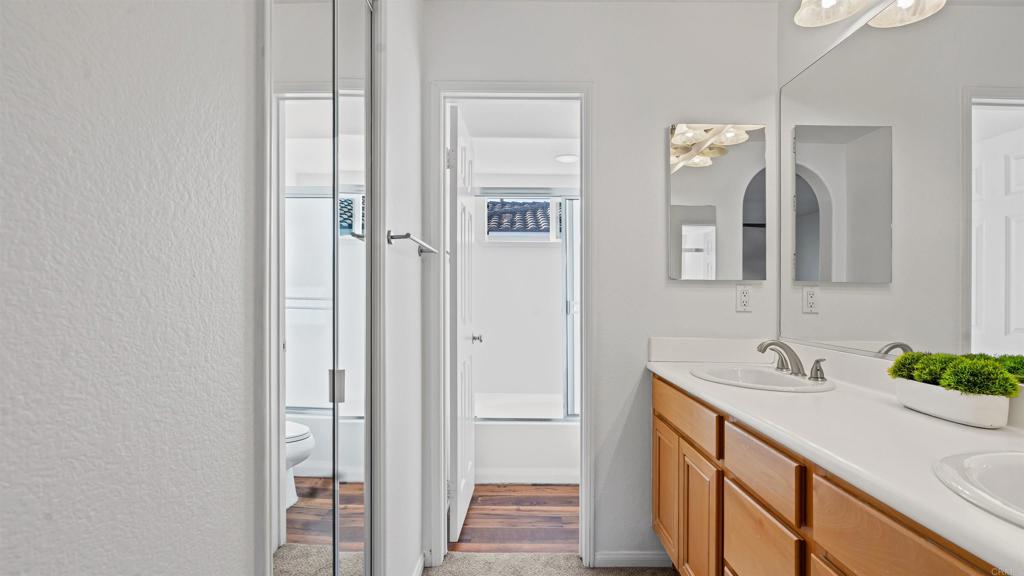 1280 Haglar Way, Unit 2 Chula Vista, CA 91913 - Photo 22 of 35 a bathroom with a sink and a mirror