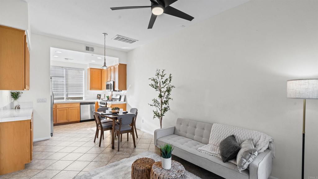 1280 Haglar Way, Unit 2 Chula Vista, CA 91913 - Photo 5 of 35 a living room with furniture and a chandelier