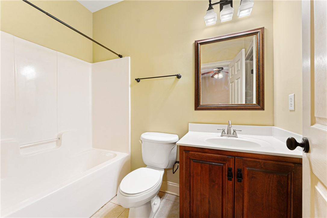 109 Limelight Drive Anderson, SC 29621 - Photo 18 of 34 This functional bathroom features a shower-tub combo, vanity, and mirror, offering everyday convenience.
