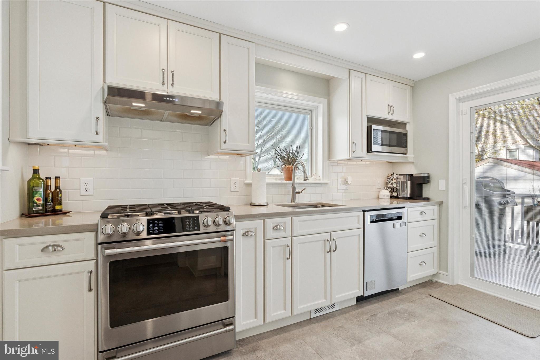 326 Maple Avenue Glenside, PA 19038 - Photo 11 of 25 a kitchen with stainless steel appliances granite countertop white cabinets a sink and dishwasher