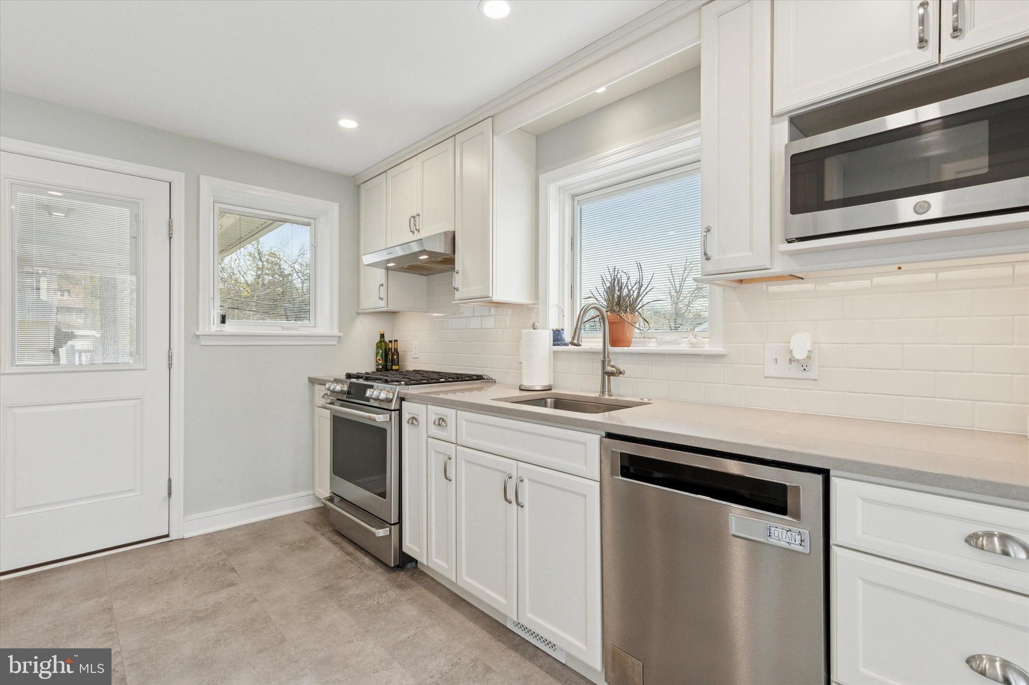326 Maple Avenue Glenside, PA 19038 - Photo 13 of 25 a kitchen with a sink stove and microwave