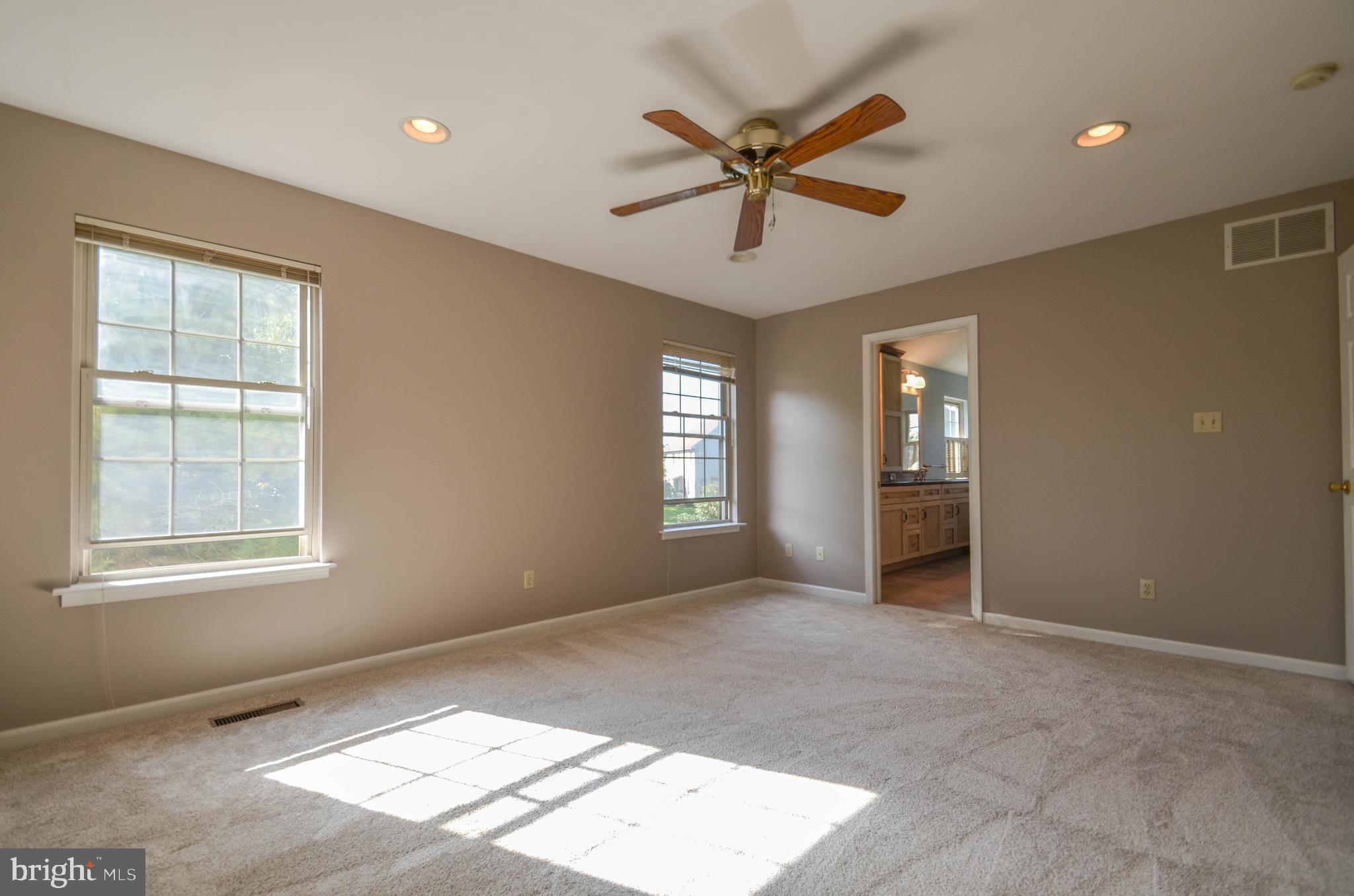 5382 Princeton Road Macungie, PA 18062 - Photo 13 of 33 a view of a big room with windows and chandelier fan